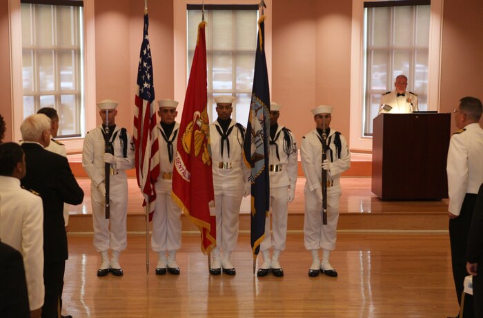 Members of the color guard with 2nd Dental Battalion, 2nd Marine Logistics Group stand at attention for the national anthem during the Navy’s Dental Corps’ 100th anniversary ball aboard Camp Lejeune, N.C., Aug. 18, 2012. During the ceremony, Marines, sailors and guests had the opportunity to celebrate with the command and learn some of the history of the Dental Corps. 