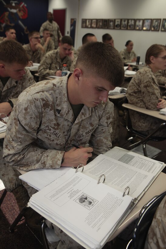 Cpl. Kalen T. Gall, an engineer equipment mechanic with Marine Wing Support Squadron 274 and a student at Cherry Point Corporals Leadership Course Class 274-12, looks at his textbook during teaches a history of the NCO class at the Training and Education Center, Aug. 16. Some of the courses included classes on leadership styles, Mentoring Marines, Leading by Example and history of the NCO portion, which teaches Marines about prior corporals and sergeants who made a difference in the Corps and in U.S. history.