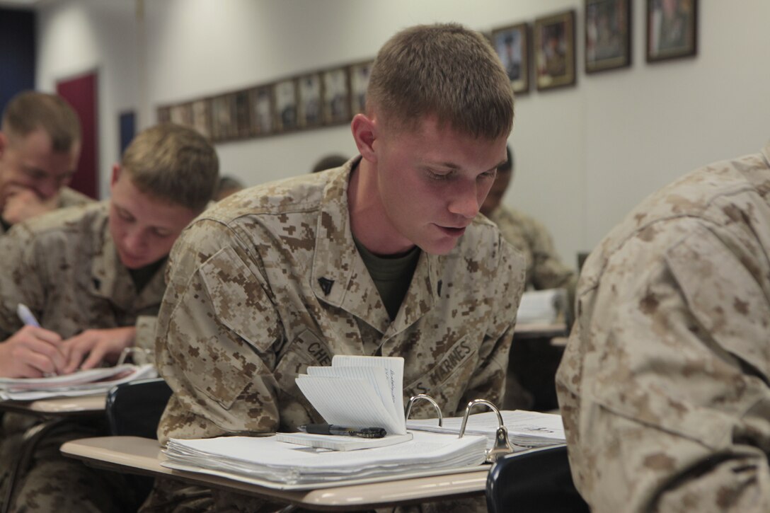 Cpl. Thomas Chevalier, KC-130J Hercules mechanic with Marine Aerial Refueler Transport Squadron 252 and a student at Cherry Point Corporals Leadership Course Class 274-12, reads from his textbook during a history of the NCO class at the Training and Education Center, Aug. 16. Some of the courses included classes on leadership styles, Mentoring Marines, Leading by Example and history of the NCO portion, which teaches Marines about prior corporals and sergeants who made a difference in the Corps and in U.S. history.