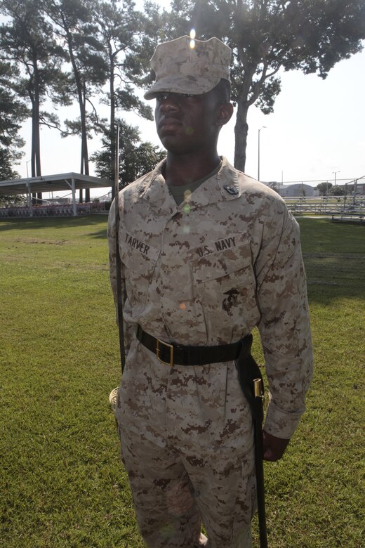 Petty Officer 3rd Class Carnell Tarver, a hospital corpsman with Naval Health Clinic Cherry Point and a student at Cherry Point Corporals Leadership Course Class 274-12, holds his "draw sword" during an introduction to sword manual, Aug. 17. The three-week course is the first Professional Military Education class enlisted Marines attend and focuses on leadership, history and tradition of Marine Corps corporals.