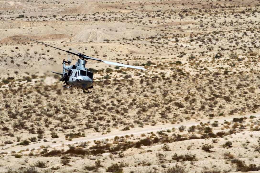 An UH-1Y â€˜Venomâ€™ provides close air support during a Fire Support Coordination Exercise as part of Enhanced Mojave Viper 7-12, July 24. Marines with Regimental Combat Team-7 coordinated close air support and artillery during the exercise designed to prepare them for an upcoming deployment to Helmand province, Afghanistan in support of Operation Enduring Freedom.