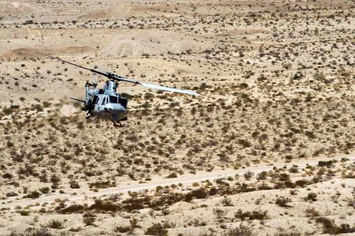 An UH-1Y â€˜Venomâ€™ provides close air support during a Fire Support Coordination Exercise as part of Enhanced Mojave Viper 7-12, July 24. Marines with Regimental Combat Team-7 coordinated close air support and artillery during the exercise designed to prepare them for an upcoming deployment to Helmand province, Afghanistan in support of Operation Enduring Freedom.