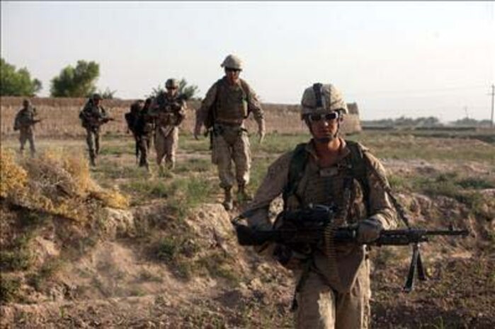 Marines from Fox Company, 2d Battalion, 5th Marines conduct a patrol in the Musa Q’ala area of the Helmand Province, Afghanistan.