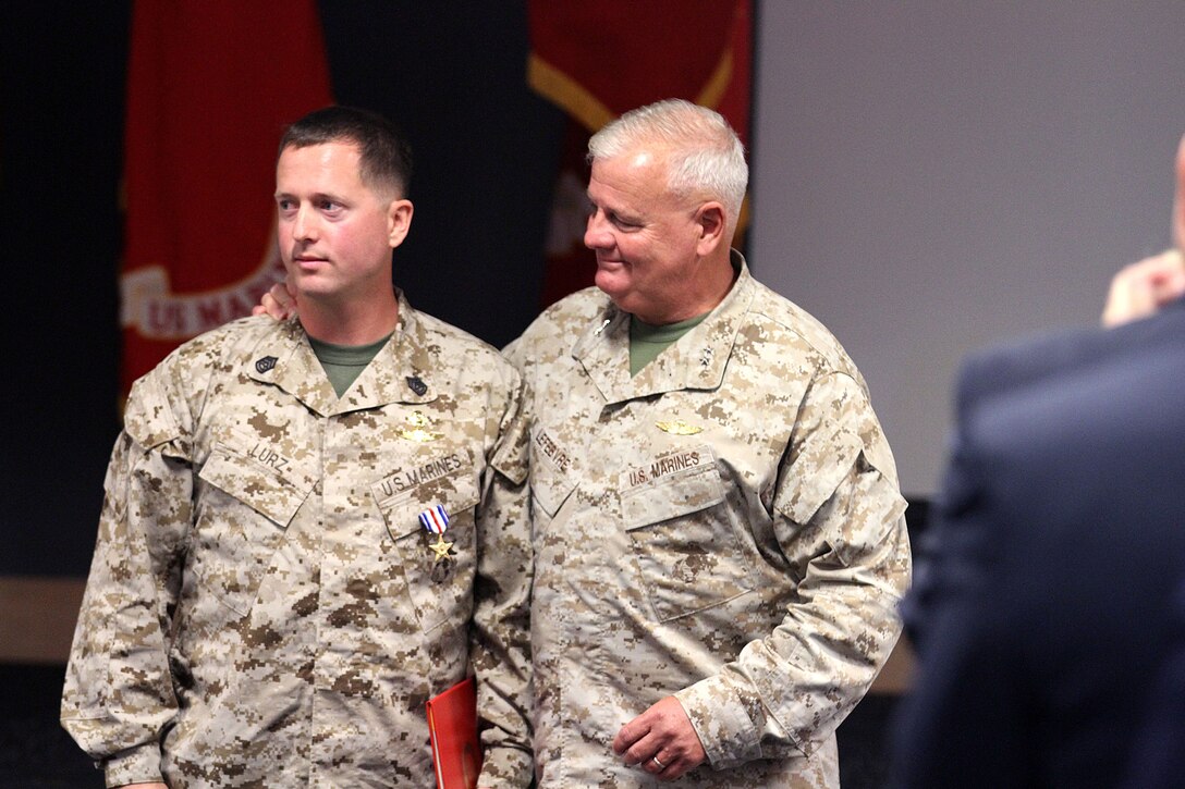 Gunnery Sgt. Joseph F. Lurz, a native of Baltimore, Md. awarded Silver Star medal by retired Major General Paul E. Lefebvre, former MARSOC Commander, Aug 24.