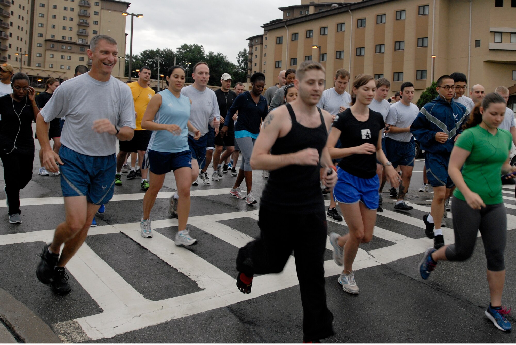 More than 50 Team Osan members ran a Woman's Equality Day 5K Aug. 24, 2012, at Osan Air Base, Republic of Korea. Lt. Col. Brian Joseph, 7th Air Force operations and plans department director, took first place in a time of 15 minutes and 48 seconds. First Lt. Candice Johnson, 6th Intelligence Squadron, took second place in a time of 16 minutes and 58 seconds. Women's Equality Day commemorates the day when women in America were given full voting rights under the U.S. Constitution by the passage of the 19th Amendment, and in 1971, the Senate and House of Representatives designated Aug. 26 of each year as Women's Equality Day. (U.S. Air Force photo/Airman 1st Class Alexis Siekert)