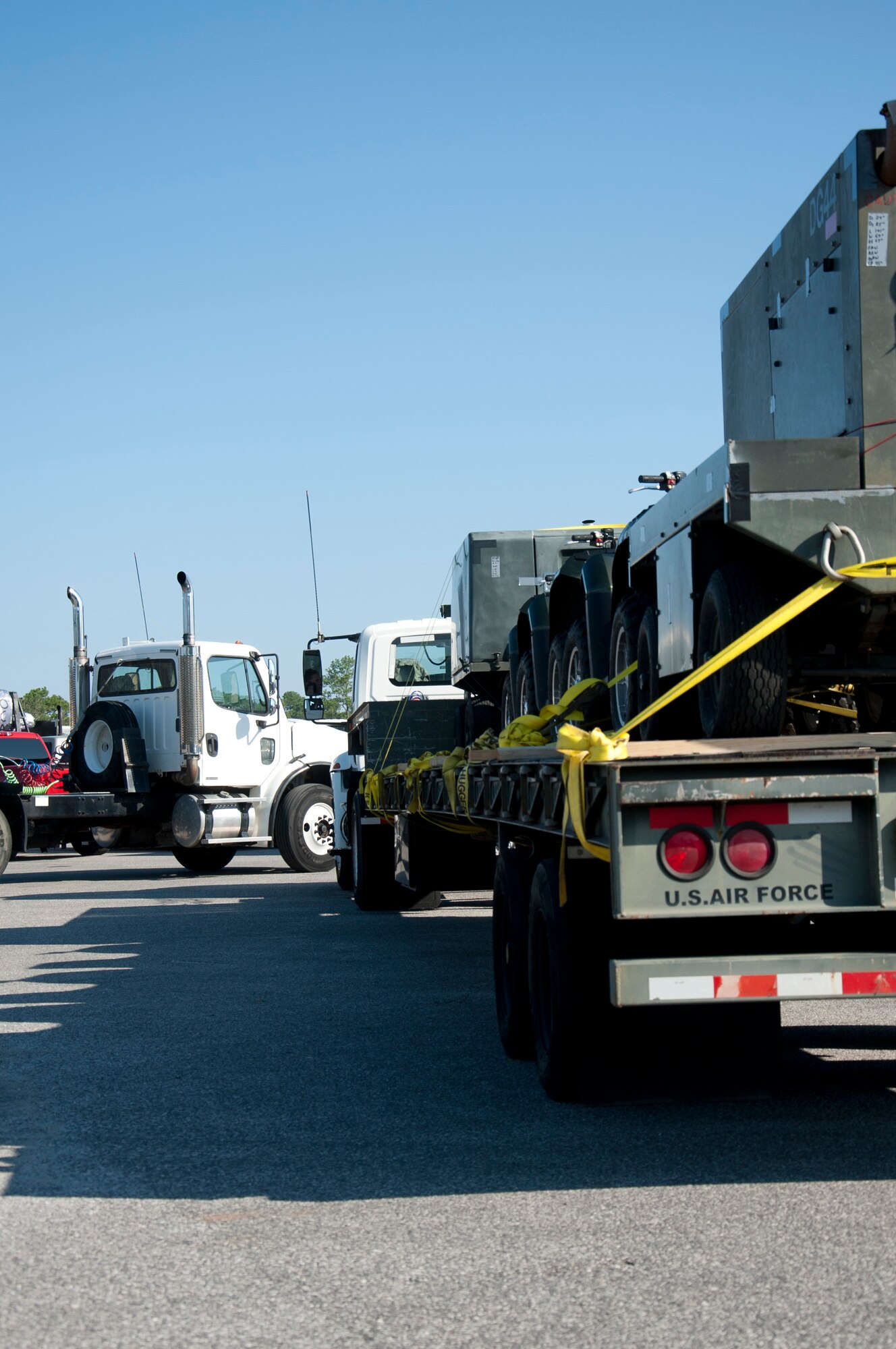 Several trucks await departure to move supplies and aircraft parts off-base in preparation for Tropical Storm Isaac at Hurlburt Field, Fla., Aug. 26, 2012.  Hurlburt Field assets were being evacuated as Tropical Storm Isaac approaches the Gulf Coast region.  (U.S. Air Force Photo/Airman 1st Class Benjamin D. Kim)