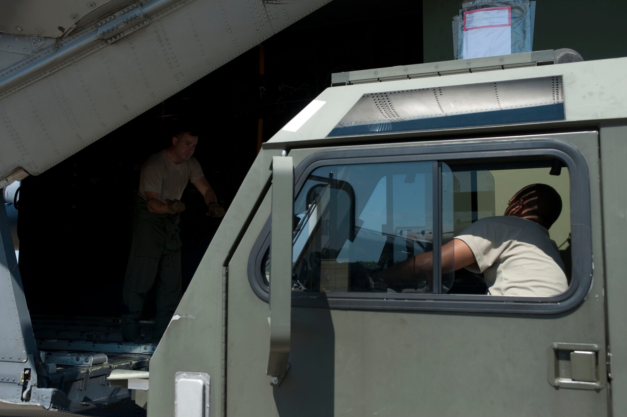 U.S. Air Force Staff Sgt. Glendelle Lisane, an air transportation craftsman from the 1st Special Operations Logistics Readiness Squadron, loads boxes of supplies onto a C-130 at the flightline on Hurlburt Field, Fla., Aug. 26, 2012. Hurlburt Field assets were being evacuated as Tropical Storm Isaac approaches the Gulf Coast Region. (U.S. Air Force Photo/Airman 1st Class Hayden K. Hyatt)