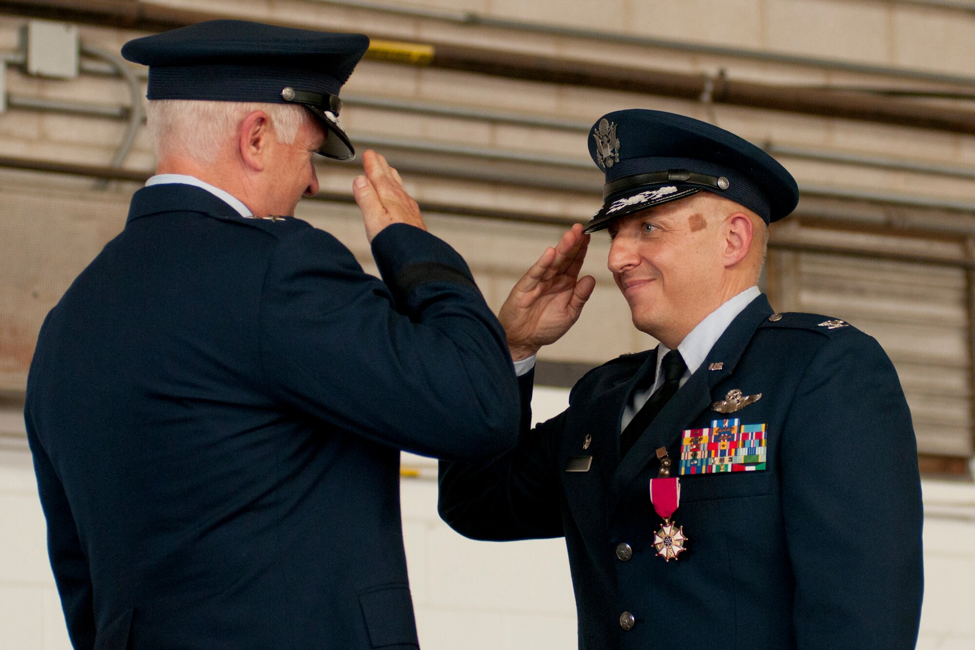 Maj. Gen. L. Scott Rice, The Adjutant General (Acting), Massachusetts National Guard, presents Col. Anthony E. Schiavi with the Legion of Merit at Otis Air National Guard Base, Mass., Aug. 25, 2012. The Legion of Merit is awarded for exceptionally meritorious conduct in the performance of outstanding services and achievements. (Air National Guard Photo by Senior Airman Jeremy Bowcock/Released)
