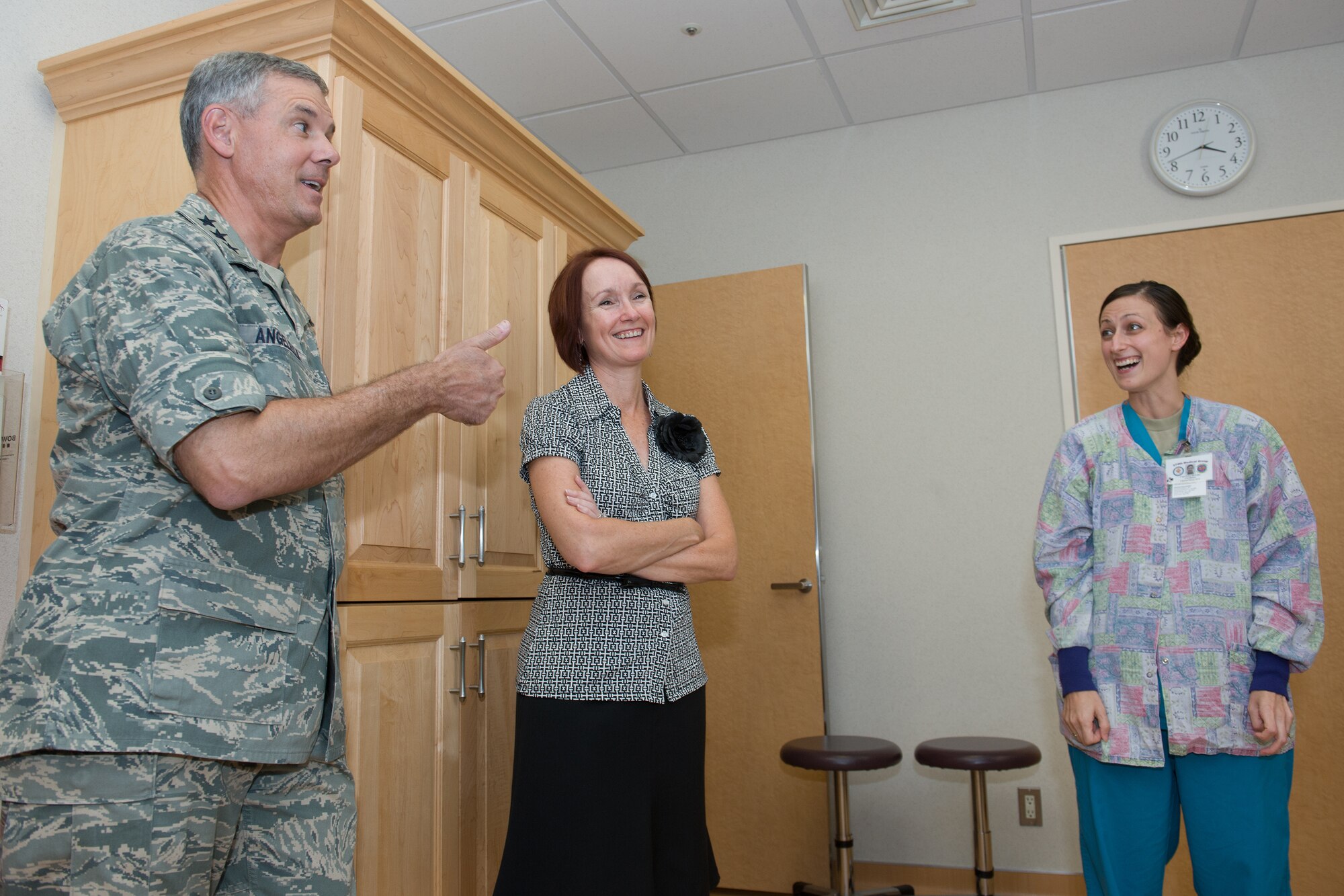 YOKOTA AIR BASE, Japan -- Lt. Gen. Sam Angelella, left, U.S. Forces, Japan, and 5th Air Force commander, gives a thumbs-up to Capt. Erica McGaha, right, 374th Medical Surgical Squadron clinical nurse, on Aug. 22, 2012, after she informed him she was born in 1984 at the same hospital she now works in at Yokota Air Base, Japan. McGaha gave Angelella and his wife, Marci, center, a tour of the 374th Medical Group Labor and Delivery clinic. (U.S. Air Force photo by Osakabe Yasuo)
