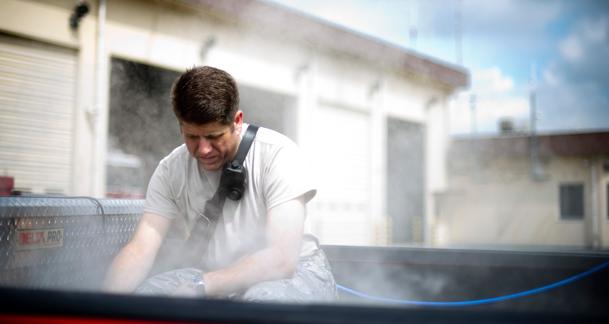 YOKOTA AIR BASE, Japan -- Master Sgt. Fred Itule, firefighter and assistant chief of training with the 374th Civil Engineer Squadron, adds solution to an artificial smoke machine at Yokota Air Base, Japan, July 30, 2012. As one of the key trainers and planners, Itule uses smoke to add realism to training scenarios, increasing the value and applicability of the training for Yokota firefighters. (U.S. Air Force photo by Staff Sgt. Stacy Moless)