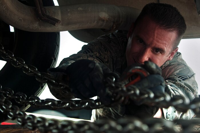 U.S. Air Force Senior Airman Neal Garret, 99th Logistics Readiness Squadron vehicle operations journeyman, secures a bobtail truck to a loading vehicle during the Logistics Compliance Assessment Program inspection Aug. 23, 2012, at Nellis Air Force Base, Nev. Several members of the 99th LRS prepared for the inspection by traveling to Shaw AFB to witness the 20th LRS LCAP inspection.  (U.S. Air Force photo by Staff Sgt. Christopher Hubenthal)