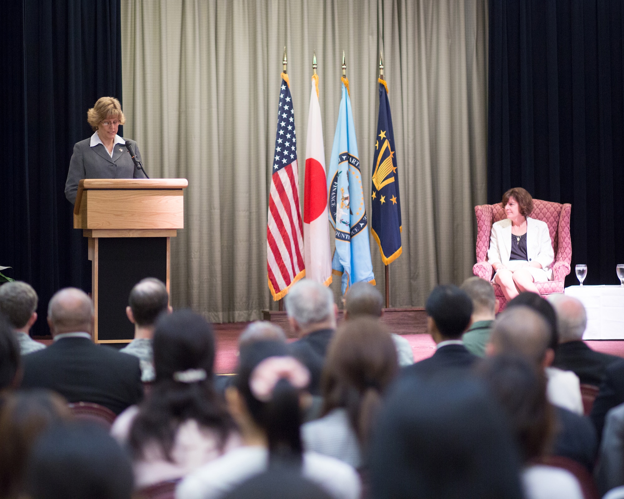 YOKOTA AIR BASE, Japan -- Jana Haynie, left, Defense Finance and Accounting Service, Japan director, gives a speech during the DFAS assumption of leadership ceremony at Yokota Air Base, Japan, Aug. 24, 2012. Haynie was the director of finance at DFAS Columbus. (U.S. Air Force photo by Osakabe Yasuo)