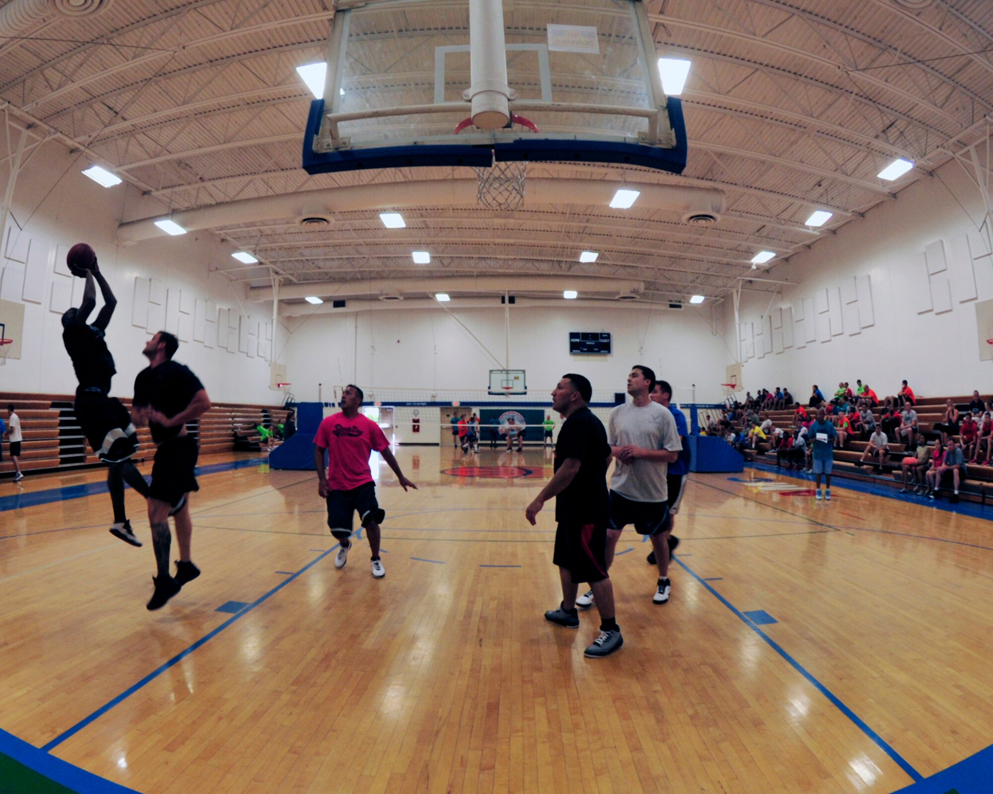 McChord Field Airmen compete in 3-on-3 basketball during Sports Day Aug. 24, 2012, at Joint Base Lewis-McChord, Wash. Other events included kickball, one-pitch softball, ultimate frisbee and the cardboard boat relay. (U.S. Air Force photo/Staff Sgt. Frances Kriss)