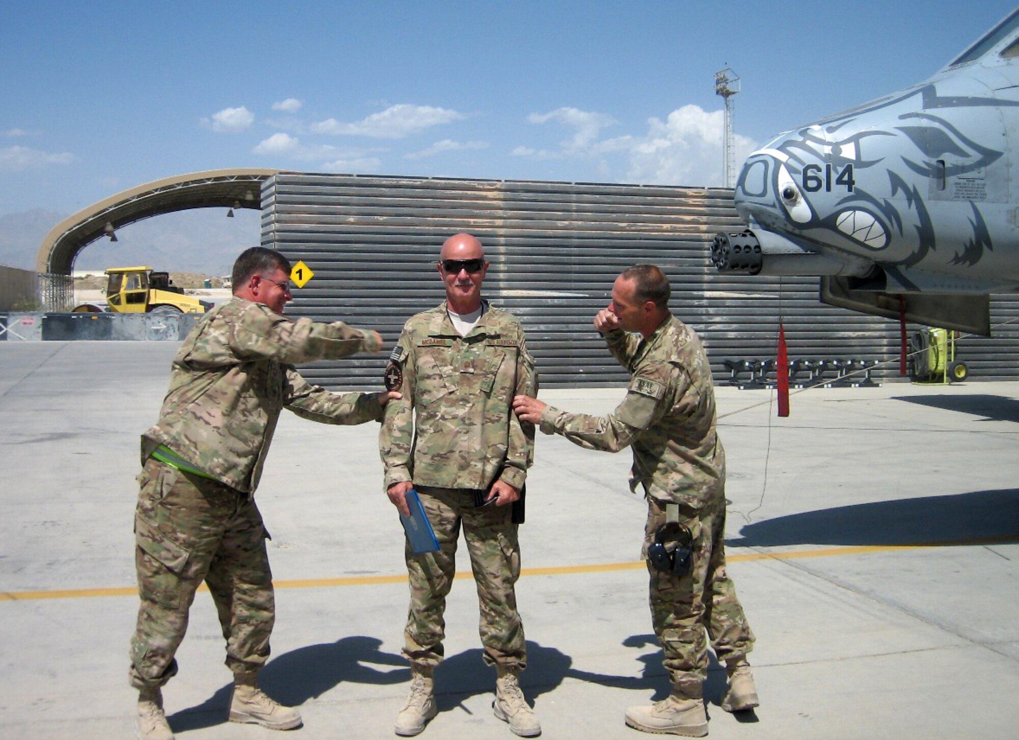 Chief Master Sgt. Fred Williams, left, and Chief Master Sgt. Donnie Frederick, right, welcome newly promoted Chief Master Sgt. Mark McDaniel to the chiefs club at Bagram Airfield, Afghanistan. All three are Airmen with the 188th Fighter Wing, which has approximately 375 Airmen currently deployed to Afghanistan in support of Operation Enduring Freedom. (Courtesy photo)