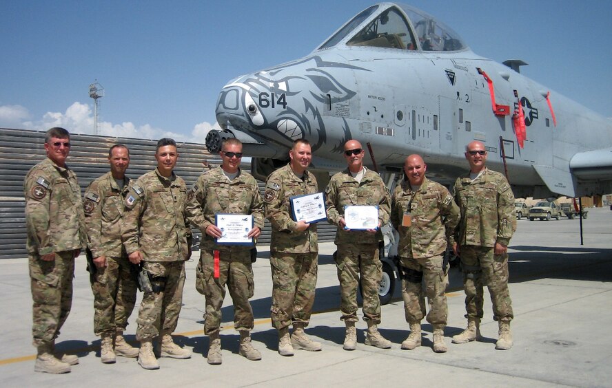 From left, Chief Master Sgt. Fred Williams, Chief Master Sgt. Donnie Frederick, Lt. Col. Rudy Cardona, Master Sgt. Paul Denton, Senior Master Sgt. Keith Weaver, Chief Master Sgt. Mark McDaniel, Maj. John Easley, Chief Master Sgt. Matthew Hopwood. Denton, Weaver and McDaniel are members of the 188th Fighter Wing and were each promoted recently at Bagram Airfield, Afghanistan. (Courtesy photo)
