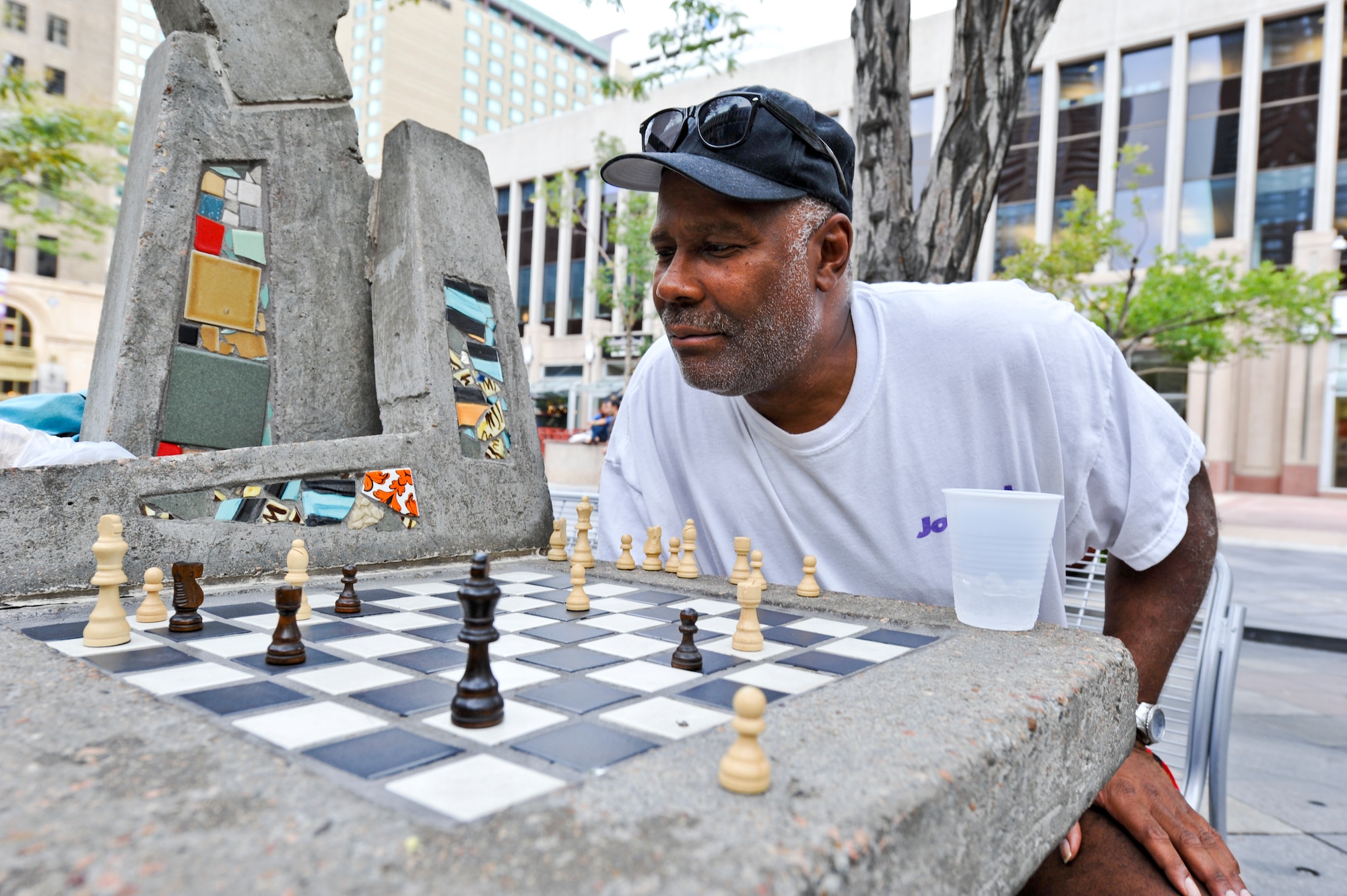 DENVER – A chess player ponders his next move during a chess match Aug. 24, 2012. Several chess and checkers tables are located throughout 16th Street downtown. Bring your own pieces as they are not provided. (U.S. Air Force photo by Senior Airman Christopher Gross)