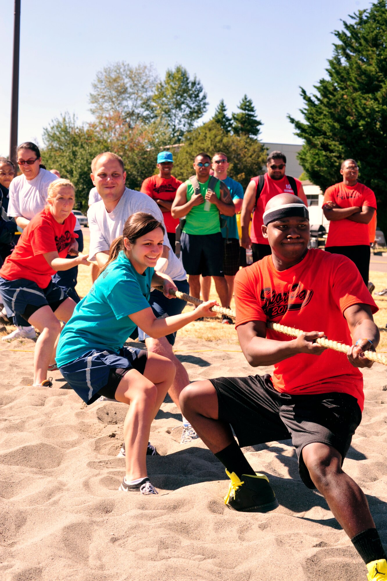 Members of the 62nd Medical Squadron pull on a rope as part of the tug-of-war competition during Sports Day Aug. 24, 2012, at Joint Base Lewis-McChord, Wash. The 627th Security Forces Squadron won this event. (U.S. Air Force photo/Staff Sgt. Frances Kriss)