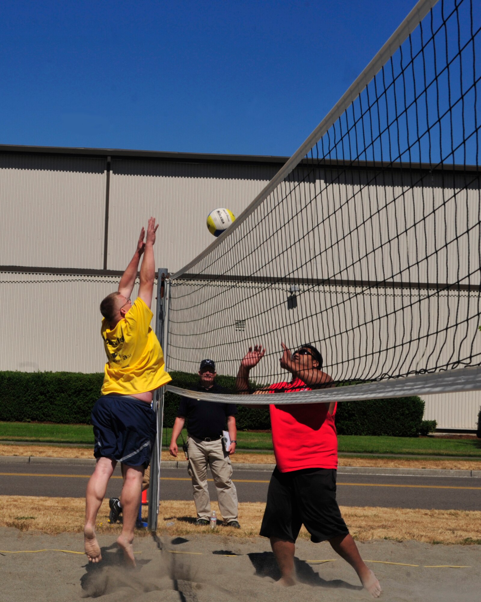 Airman 1st Class Logan Copple, 62nd Comptroller Squadron, jumps in an attempt to block a pass during the volleyball competition Aug. 24, 2012, at Joint Base Lewis-McChord, Wash. The 627th Logistics Readiness Squadron won this event. (U.S. Air Force photo/Staff Sgt. Frances Kriss)