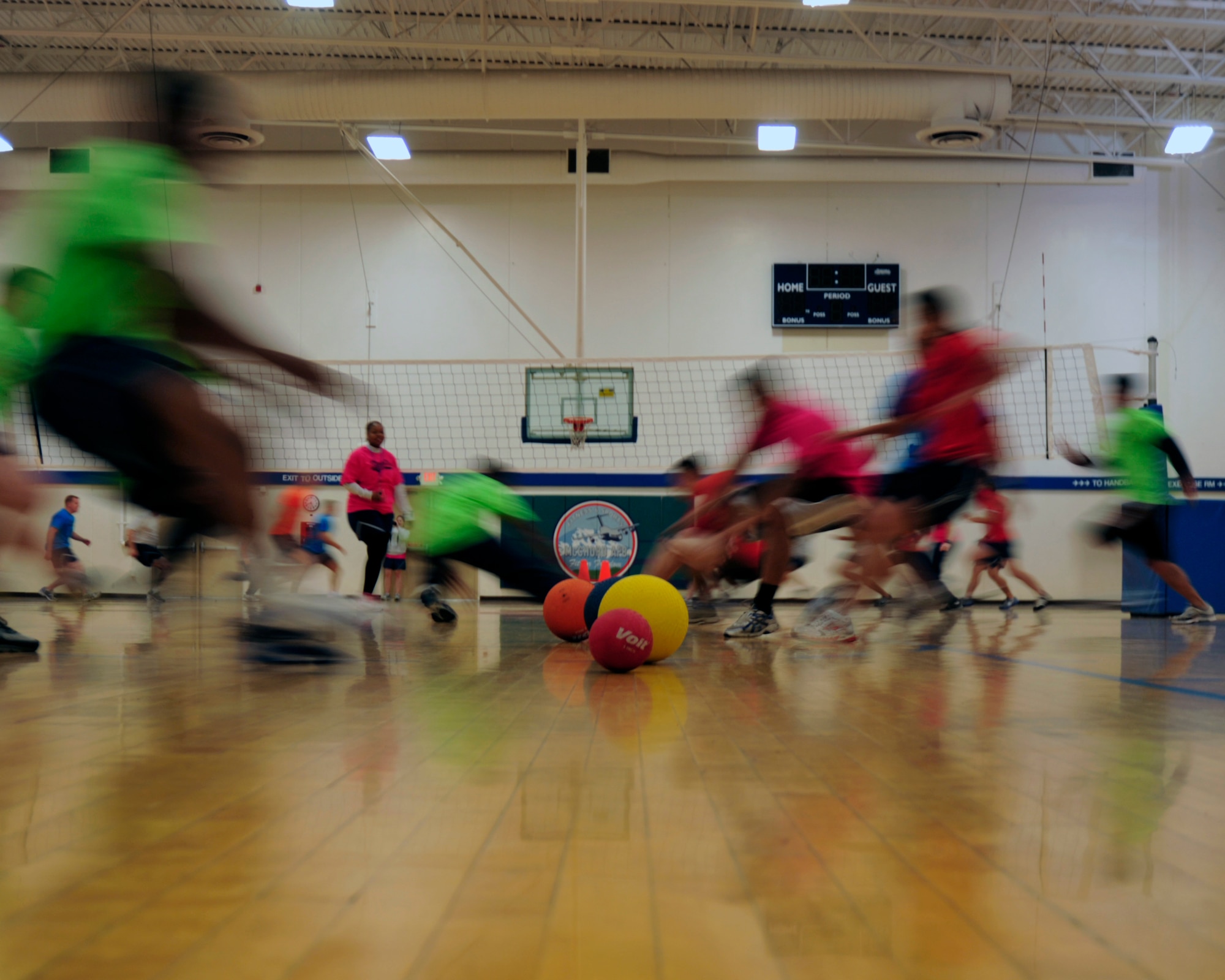 Teams rush to grab a ball as part of the dodgeball competition during Sports Day Aug. 24, 2012, at Joint Base Lewis-McChord, Wash. The 5th Air Support Operations Squadron took first place in the competition. (U.S. Air Force photo/Staff Sgt. Frances Kriss)