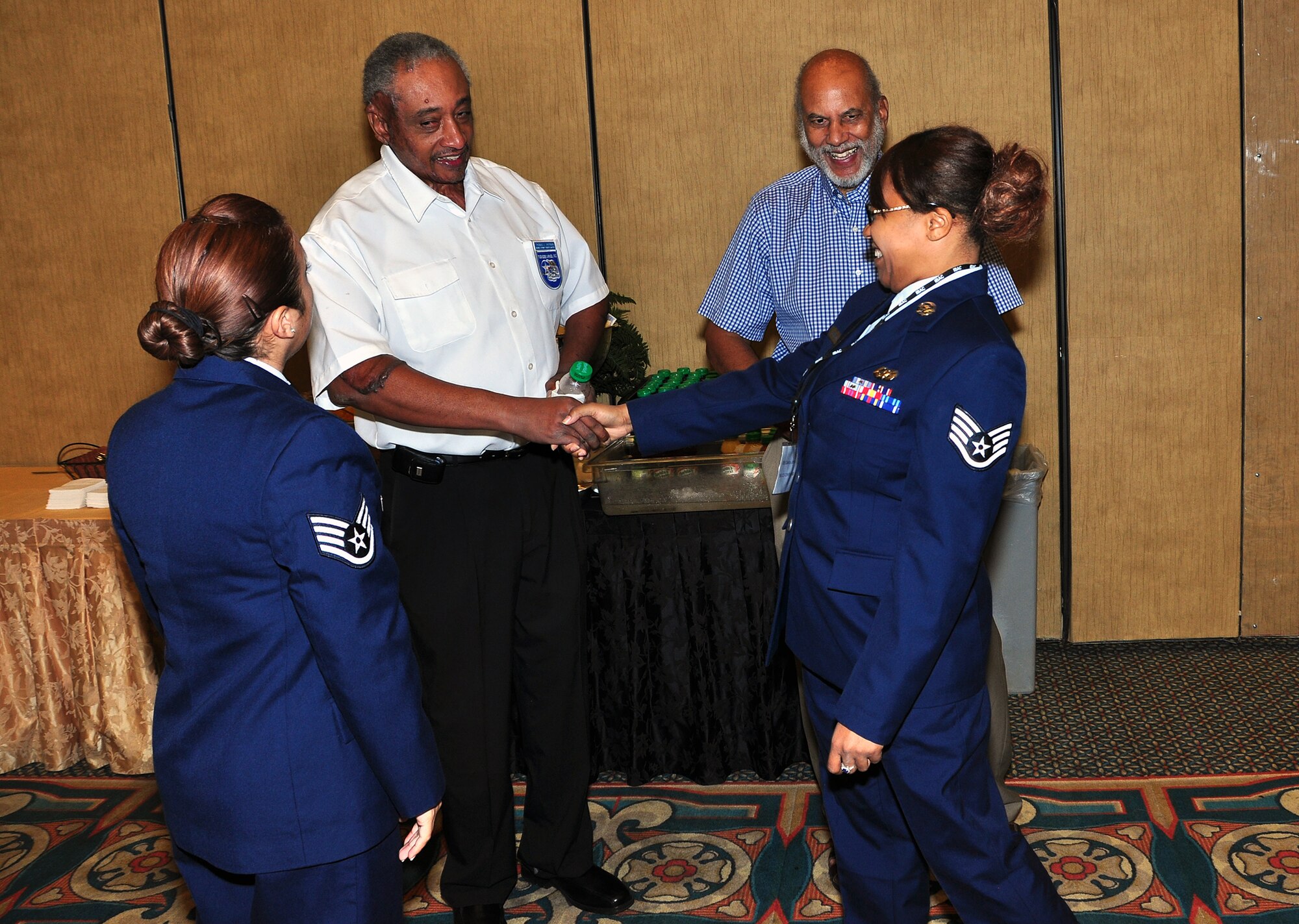 Staff Sgts. Candice Johnson and Dalia Nesmith, both of the 94th Airlift Wing attended the Tuskegee Airmen Inc.’s 2012 national convention in Las Vegas July 31 – Aug. 3. The two Staff Sgts. participated in the convention’s youth day where they met with members of the Tuskegee Airmen Inc. to work on youth advocacy and education. (U.S. Air Force photo/Senior Airman Elizabeth Van Patten)