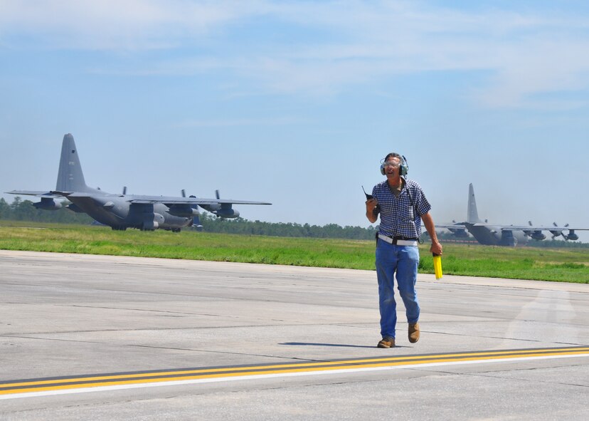 Robert Wegeman Jr, a 919th Aircraft Maintenance Squadron maintainer, walks off the flightline after marsalling a departing Duke Field MC-130E aircraft.  Along with many basewide preparations, the 919th Special Operations Wing evacuated its aircraft to Fort Campbell, Ky., Aug. 24-26 to shelter them due to the threat of Hurricane Isaac.  (U.S. Air Force photo/Dan Neely)