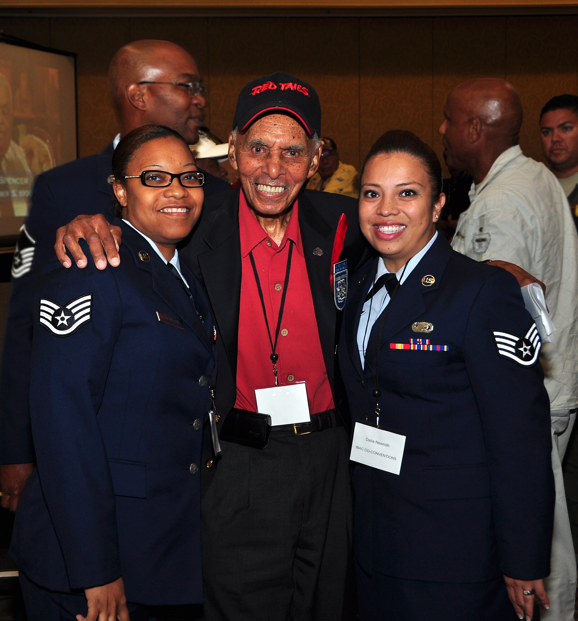 Staff Sgts. Candice Johnson and Dalia Nesmith, both of the 94th Airlift Wing attended the Tuskegee Airmen Inc.’s 2012 national convention in Las Vegas July 31 – Aug. 3. The two Staff Sgts. participated in the convention’s panel discussions where they met with original member of the Tuskegee Airmen, retired Capt. Roscoe C. Brown. (U.S. Air Force photo/Senior Airman Elizabeth Van Patten)