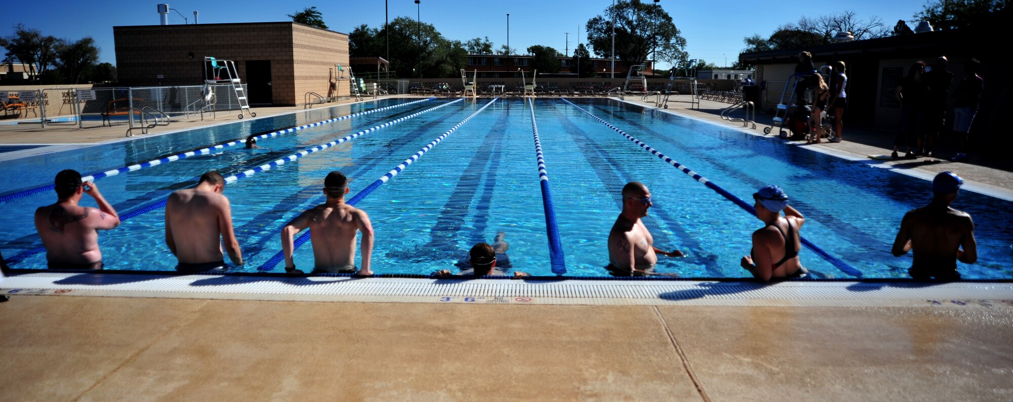 Competitors for the mini triathlon line up in preparation at the DZ Pool at Cannon Air Force Base, N.M., Aug. 25, 2012.  This fitness challenge included a 500-meter lap swim, 8.5-mile bike ride and a 3.2-mile run.  (U.S. Air Force photo/Senior Airman Whitney Tucker)