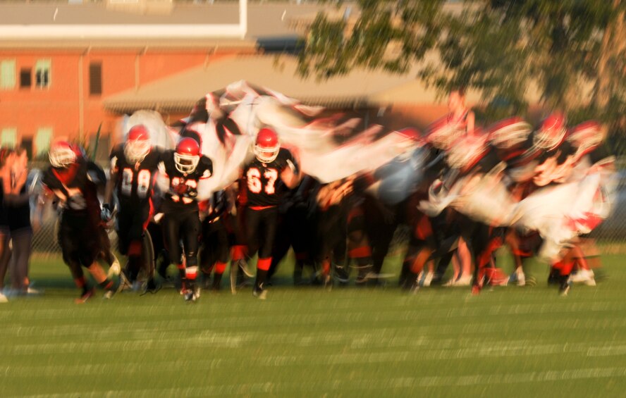 Lanier County High School Bulldogs team members storm the field as they prepare to take on the Atkinson County High School Rebels at Roquemore Field in Lakeland, Ga., Aug. 24, 2012. This game was the season opener for both teams. (U.S. Air Force photo by Senior Airman Douglas Ellis/Released)
