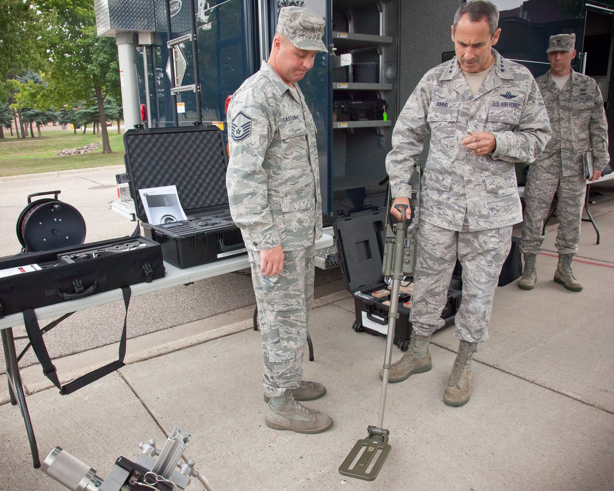 Gen. Raymond E. Johns, Commander, Air Mobility Command, is shown some of the equipement used in the explosives ordnance disposal mission at the 934th Airlift Wing by Master Sgt. Scott T. Castleman.  The general is visiting the wing as part of a tour to visit all of the reserve and guard units in the country, talking to Airmen and leadership to understand what issues are important to the Air Force at a local level.  (U.S. Air Force Photo/Shannon McKay)