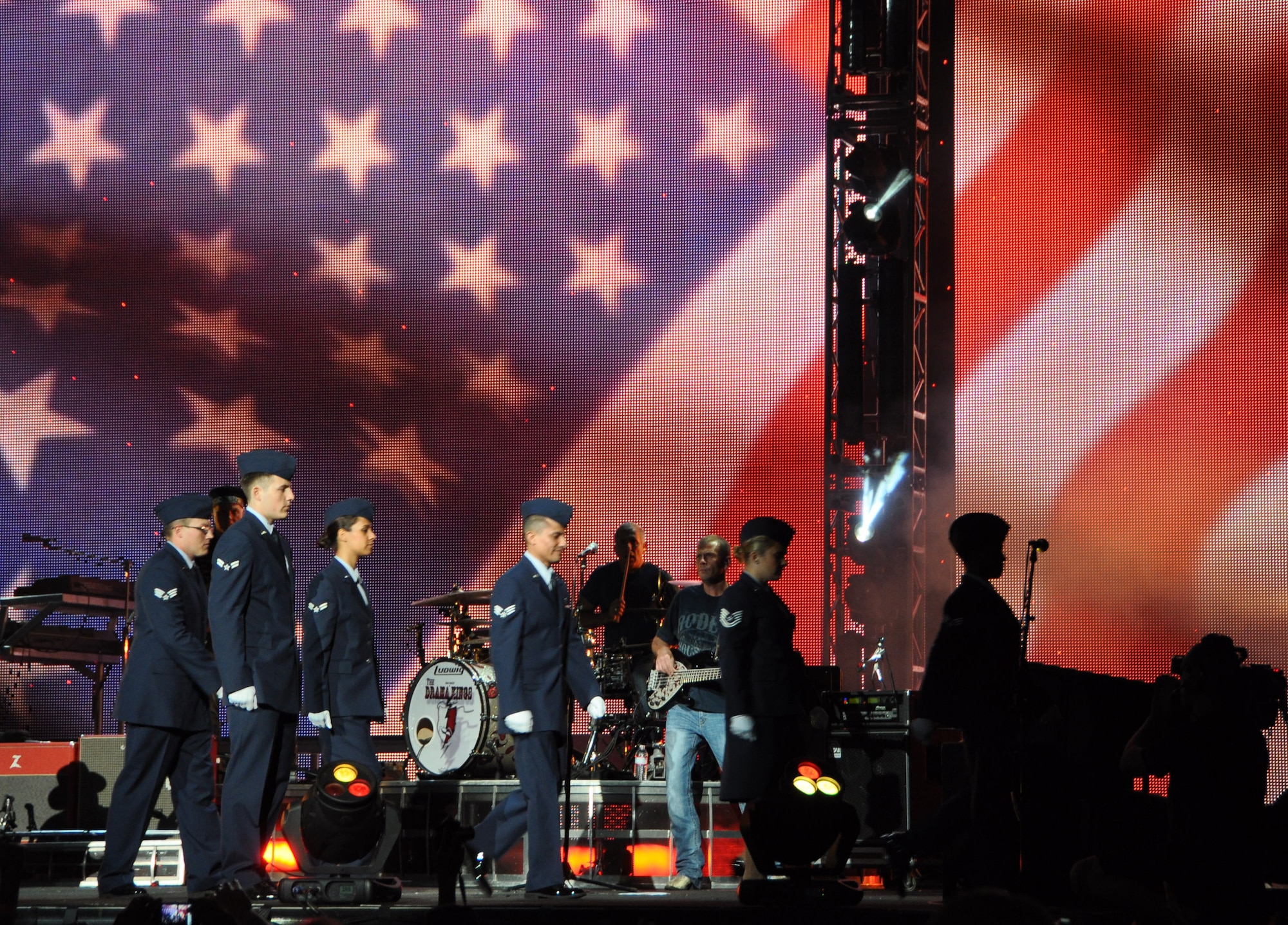 Airmen from the 69th Aerial Port Squadron exit the stage at the country music artist, Brad Paisley concert, Jiffy Lube Live Amphitheater, Bristow, Va., Aug. 25, 2012. The Airmen were invited to march on stage during Paisley’s song, “This is country music” and salute the flag. (U.S. Air Force photo/ Senior Airman Katie Spencer)