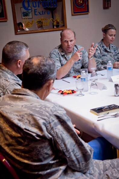 Gen. Raymond E. Johns, Commander, Air Mobility Command, listens to Col. Cam J. LeBlanc discusses his plans keep the aircraft in the best condition possible.  The general is visiting the 934th Airlift Wing as part of a tour to visit all of the reserve and guard units in the country, talking to Airmen and leadership to understand what issues are important to the Air Force at a local level.  (U.S. Air Force Photo/Shannon McKay)