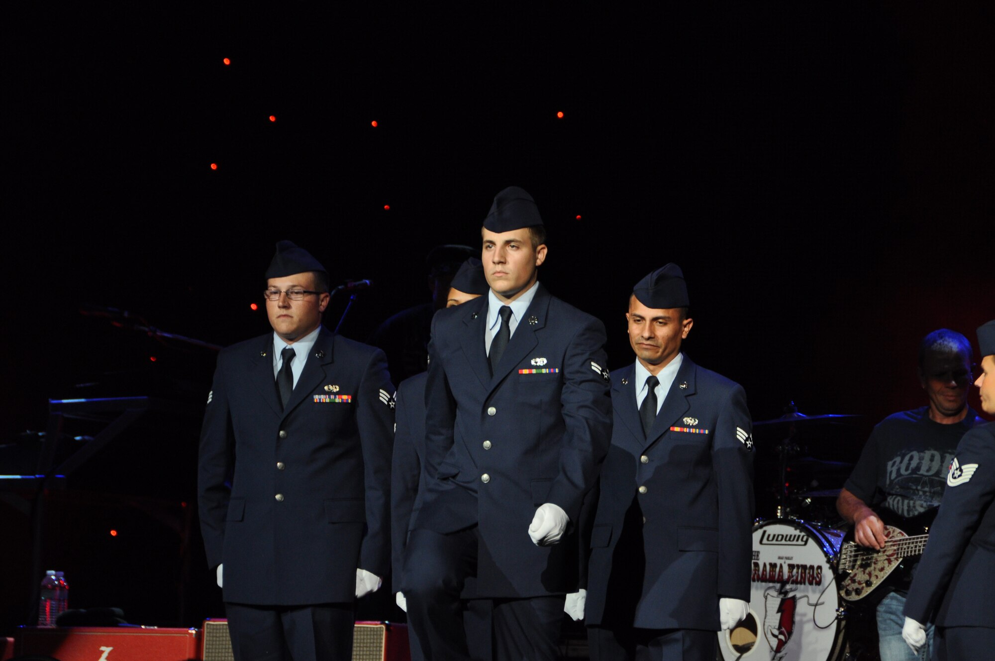 Airmen from the 69th Aerial Port Squadron enter the stage at the country music artist, Brad Paisley concert, Jiffy Lube Live Amphitheater, Bristow, Va., Aug. 25, 2012. The Airmen were invited to march on stage during Paisley’s song, “This is country music” and salute the flag. (U.S. Air Force photo/ Senior Airman Katie Spencer)