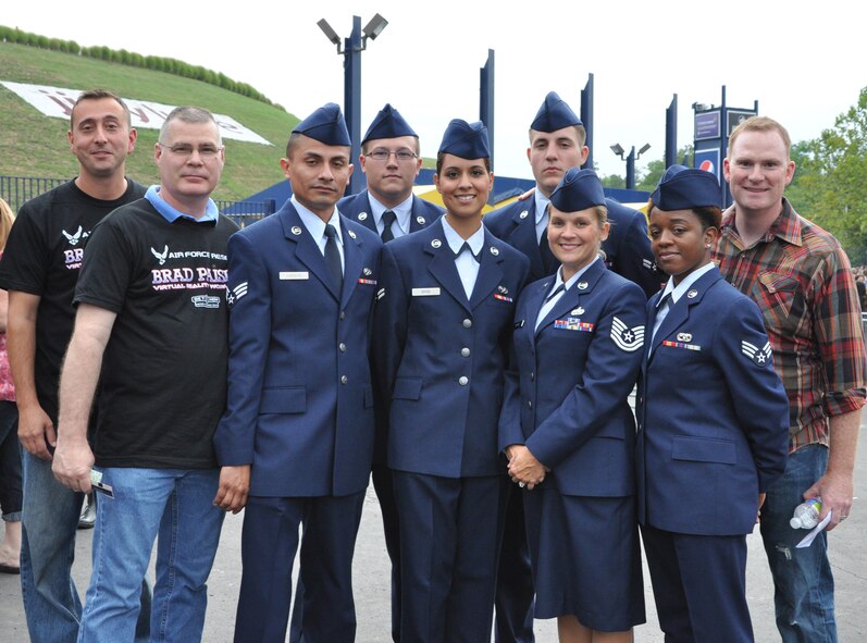 Airmen from the 69th Aerial Port Squadron pose for a picture at the country music artist, Brad Paisley concert, Jiffy Lube Live Amphitheater, Bristow, Va., Aug. 25, 2012. The Airmen were invited to march on stage during Paisley’s song, “This is country music” and salute the flag. From left in service dress: Senior Airman Michael Cordero, Senior Airman Ryan Brice, Senior Airman Dolly Spice, Airman 1st Class Jason Jackson, Tech. Sgt. Heather Wood and Senior Airman Monique Yates. (U.S. Air Force photo/ Senior Airman Katie Spencer)