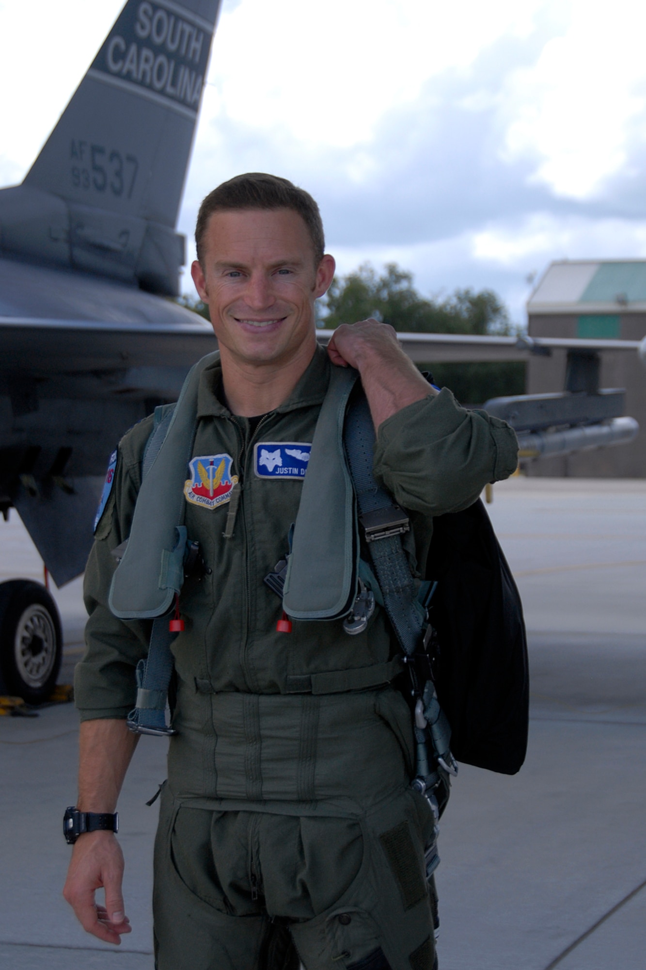 Capt. Justin "Alf" Dumais, an F-16 fighter pilot with the 157th Fighter Squadron at McEntire Joint National Guard Base, S.C., poses for his photo to be taken on the flight line August 5, 2012.
(SCANG photo by Tech. Sgt. Caycee Watson)
