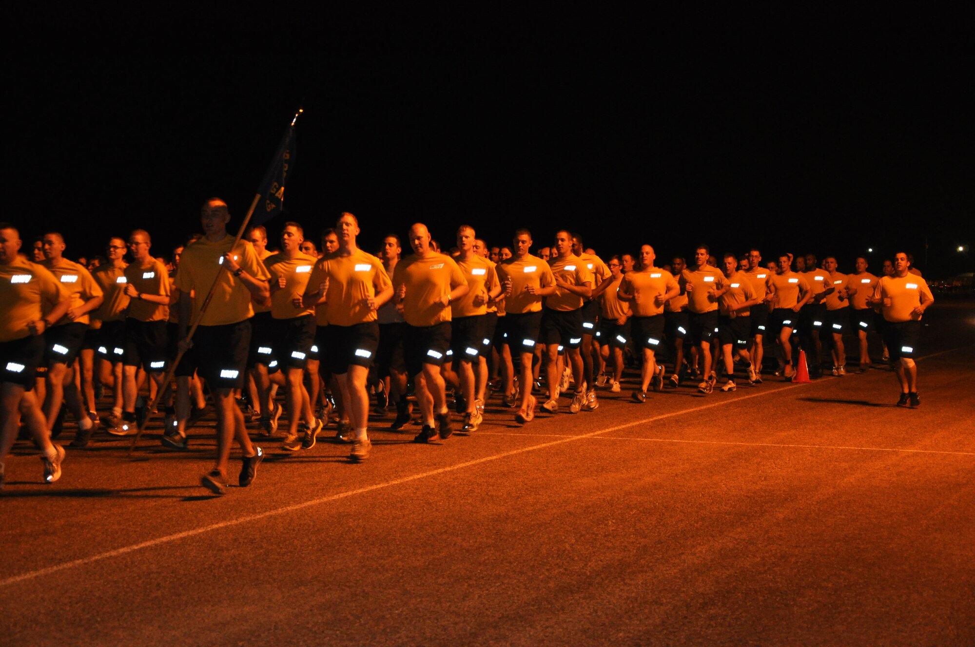 Members from the Navy Center for Information Dominance Detachment participate in the Goodfellow Wing Run Aug. 24 here. During the quarterly Wing Run, members run down the old flight line, which is now known a Kickapoo Trail. (Air Force Photo/ Airman 1st Class Erica Flores)