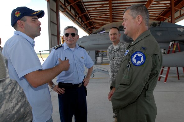 Col. Mike Hudson, 169th Fighter Wing Commander at McEntire Joint National Guard Base, S.C., speaks with members of a Colombian delegation during their tour of base facilities July 24, 2012. The visit occurred one day after announcing the State Partnership between South Carolina and the Republic of Colombia. The historic bilateral partnership will promote mutual capabilities, national security objectives and long term stability.
(SCANG photo by Tech. Sgt. Caycee Watson)
