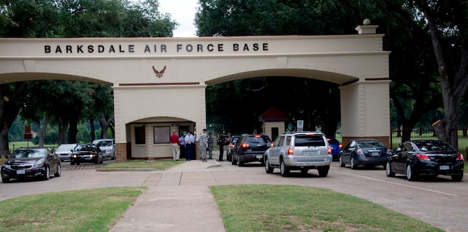 Team Barksdale members drive through the West Gate on Barksdale Air Force Base, La., Aug. 27. The gate re-opened at 8 a.m. with a ribbon cutting ceremony. The canopy now provides 2nd Security Forces members cover from inclement weather, enhances base security and gives the base a more professional look. (U.S. Air Force photo/Senior Airman La?Shanette V. Garrett)(RELEASED) 