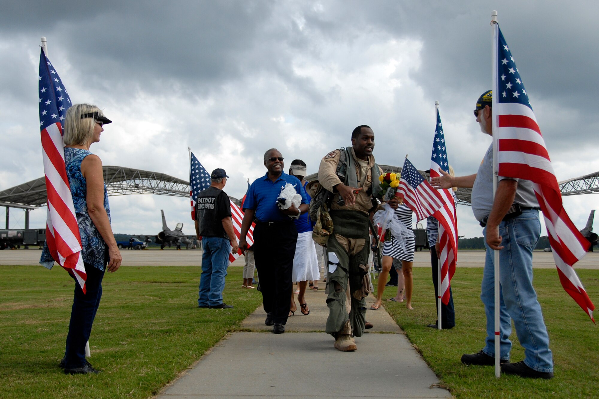 Maj. Taj "Kong" Troy, an F-16 Fighting Falcon fighter pilot with the 157th Fighter Squadron at McEntire Joint National Guard Base, S.C., returns home to a hero's welcome after a four-month Air Expeditionary Force deployment at Kandahar Airfield, Afghanistan, Aug. 23, 2012. Swamp Fox F-16's, pilots, and support personnel began their AEF deployment in support of Operation Enduring Freedom in early April to take over flying missions for the air tasking order and provide close air support for troops on the ground in Afghanistan.