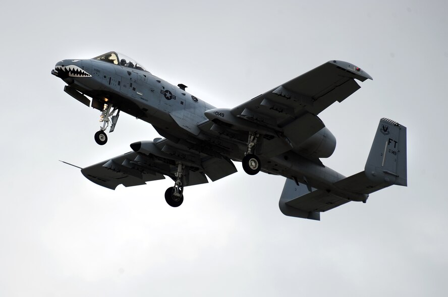 An A-10 Thunderbolt II flies past show center as part of the practice Air Show hosted by Offutt Air Force Base, Neb., Aug. 24.  The day before the scheduled air show gives children with special needs, Make-A-Wish participants and Wounded Warriors the VIP treatment with their own personal performance and meetings with pilots and commanders.  (U.S. Air Force Photo by Josh Plueger/Released)