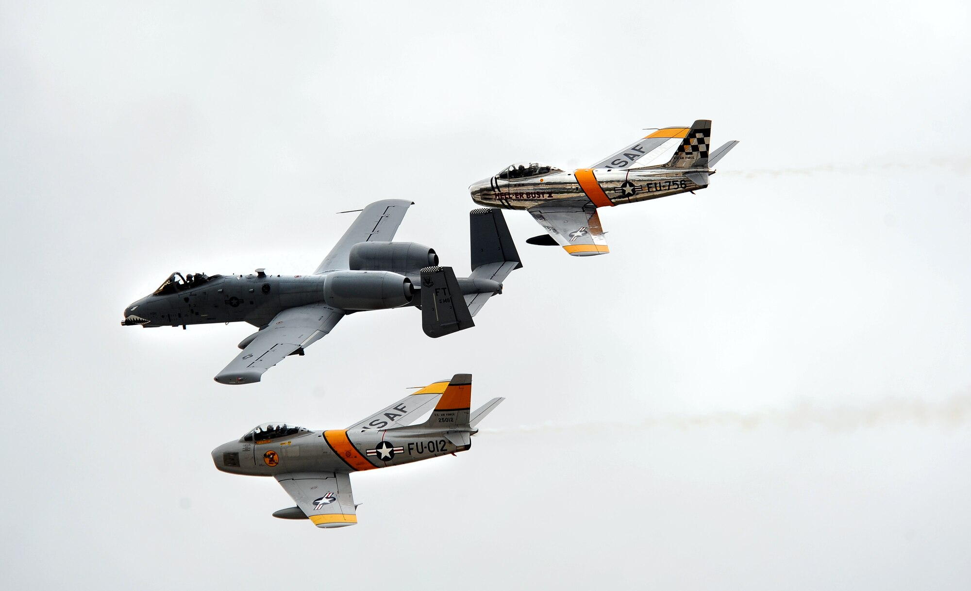 A heritage flight that included two F-86 Sabres flanking an A-10 Thunderbolt II demonstrated the proud heritage of military aviation over the past 60 years at Offutt Air Force Base, Neb., Aug. 24. The 2012 Defenders of Freedom Open House and Air Show included this and many other aerial demonstrations as well as ground shows and static aircraft displays.  (U.S. Air Force Photo by Josh Plueger/Released)
