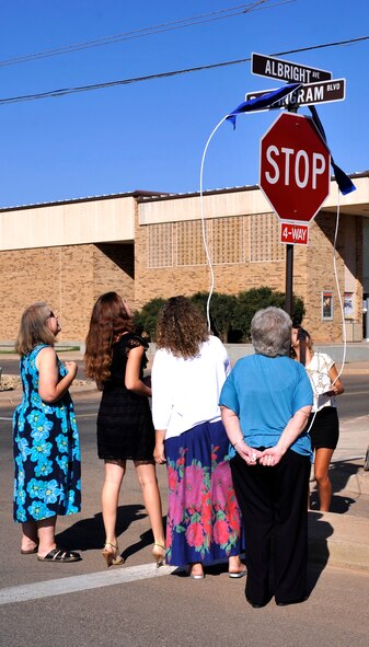 Members of the Ricci family unveil the a street sign renamed in honor of Airman 1st Class Richard Albright at Cannon Air Force Base, N.M., Aug. 27, 2012. Albright was killed in action while serving in the Korean War and in order to honor his sacrifice Cannon leadership renamed Trident Ave. to Albright Ave. (U.S. Air Force photo/Airman1st Class Ericka Engblom)