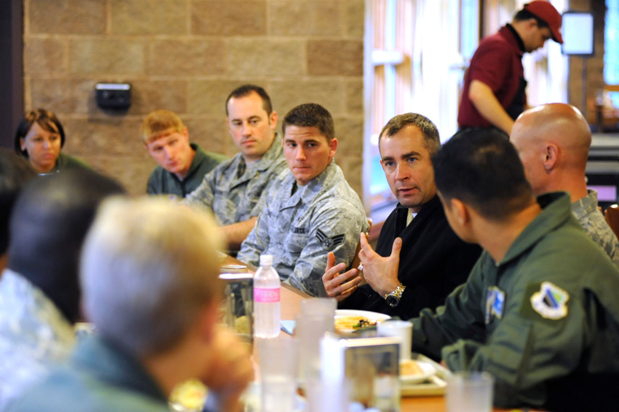 Command Master Chief Mark Rudes answers questions from JBER's top performers during lunch in the Iditarod Dining Facility in JBER, Alaska, Aug. 14. Rudes visited JBER Aug. 14 to Aug. 16 to introduce himself and explain his role and JBER's role in the Pacific Command to the troops. Rudes is the Pacific Command senior enlisted advisor, responsible for developing senior enlisted partnerships among the various branches of service in 36 countries.(U.S. Air Force photo/Staff Sgt. Robert Barnett)