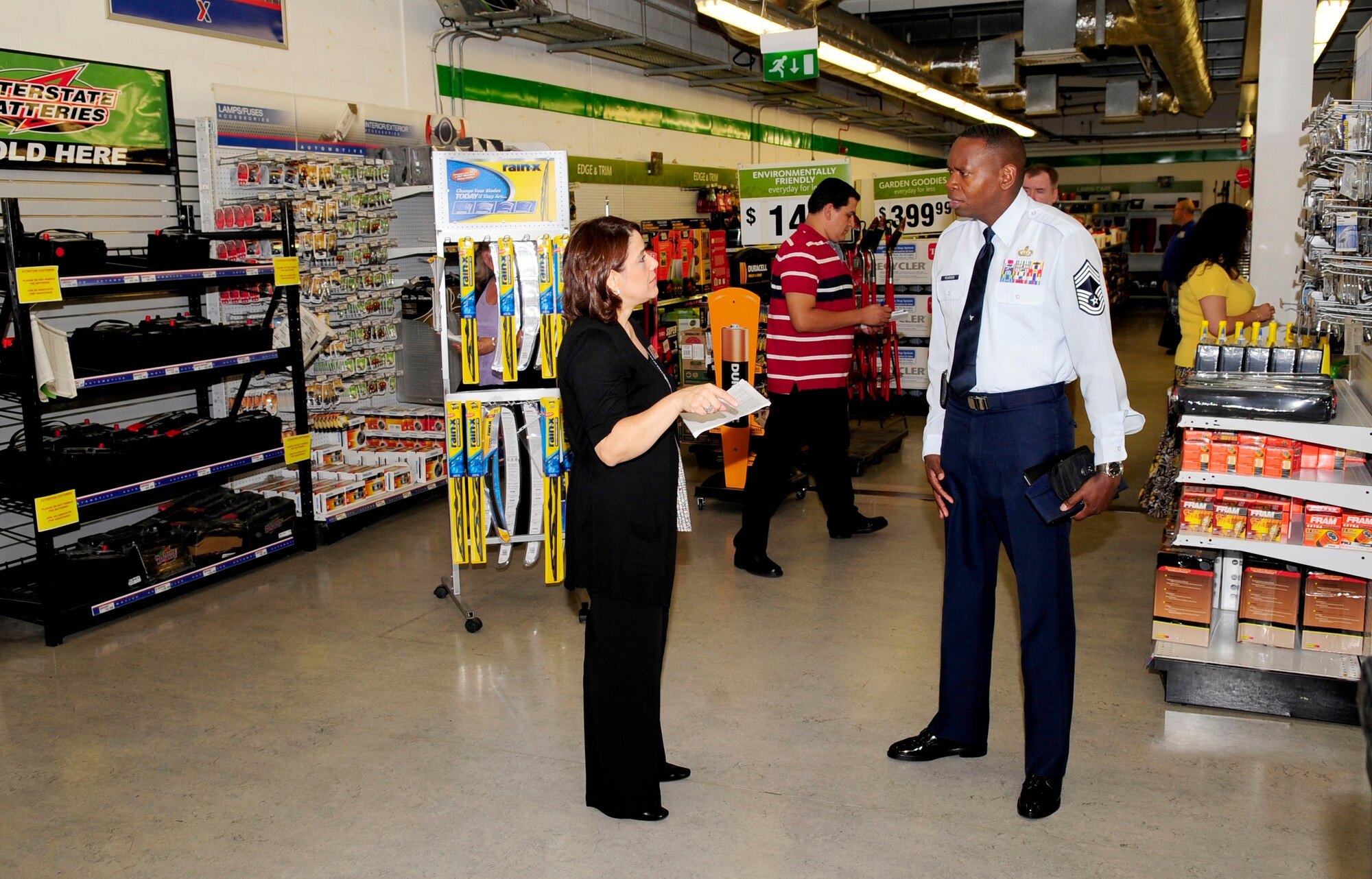 RAF MILDENHALL, England – Linda Saucedo, BXtra store manager, gives Chief Master Sgt. Anthony Pearson, Army and Air Force Exchange Services Senior Enlisted Advisor, a tour of the RAF Mildenhall BXtra Aug. 27, 2012, during a site visit here. Pearson conducted a site tour to evaluate the exchanges here and several other U.K. bases. (U.S. Air Force/photo Senior Airman Ethan Morgan)