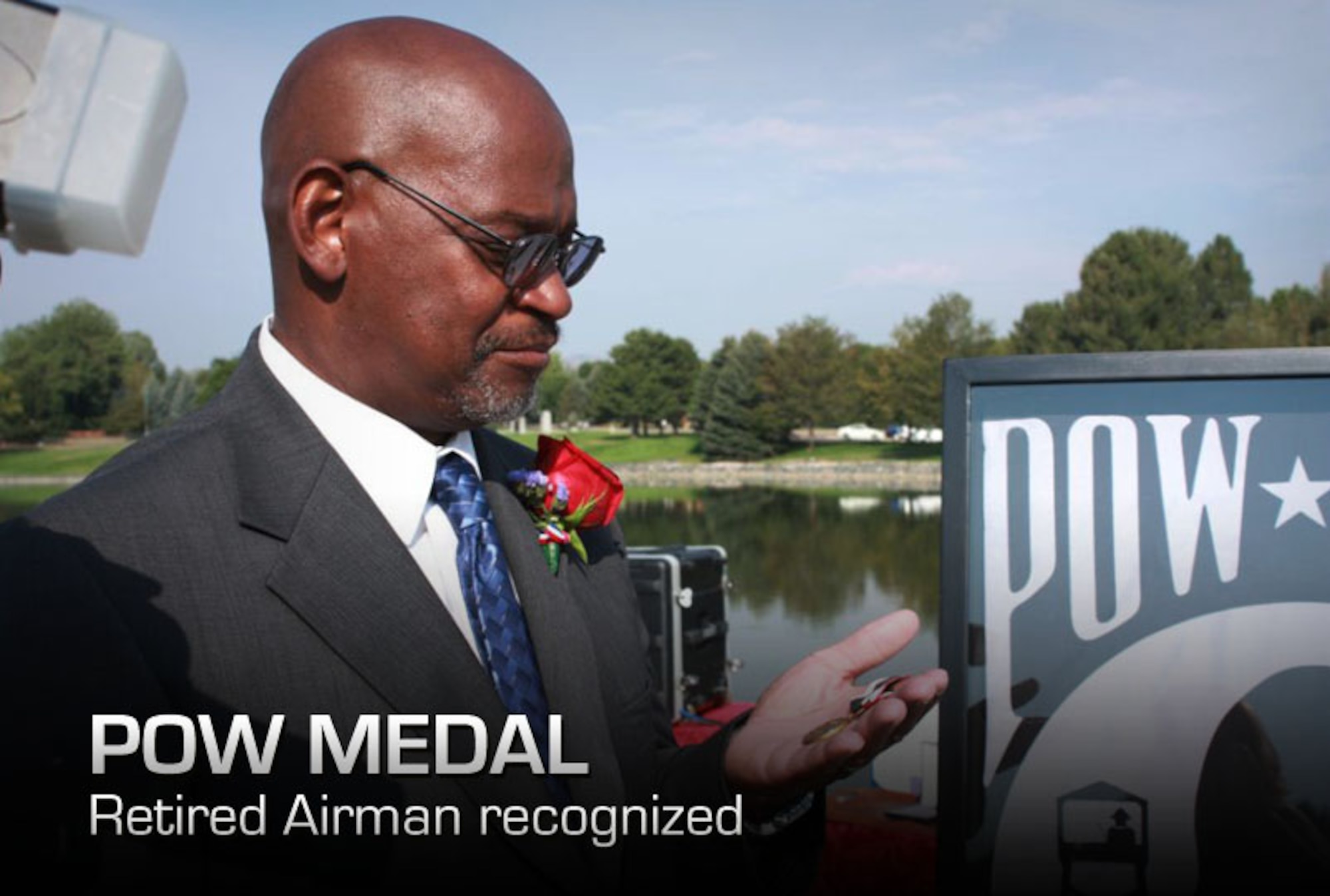 Retired Master Sgt. James Hughes holds the POW Medal at Fort Logan National Cemetery, Denver, Colo., Aug. 22, 2012. Hughes spent 16 days as hostage to Iranian militants in Tehran, Iran, after they stormed the U.S. Embassy on Nov. 4, 1979. (Courtesy photo/Elaine Buehler)