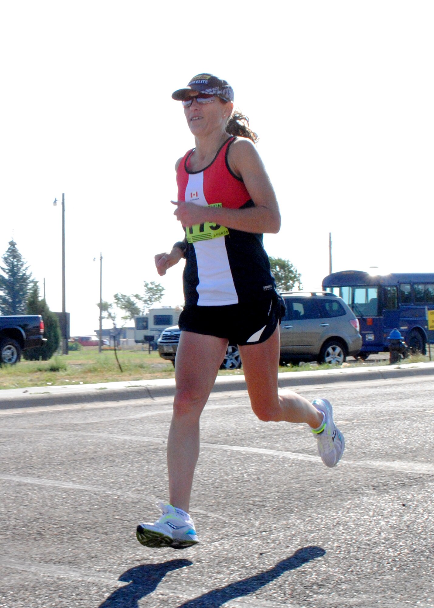 Setting an example of physical fitness, Jacqueline Maillet, 341st Medical Operations Squadron health and wellness dietitian, crosses the finish line with a time of 1 hour, 48 minutes and 28 seconds. Maillet was the first female to finish the half marathon. (U.S. Air Force photo/Airman 1st Class Katrina Heikkinen)
