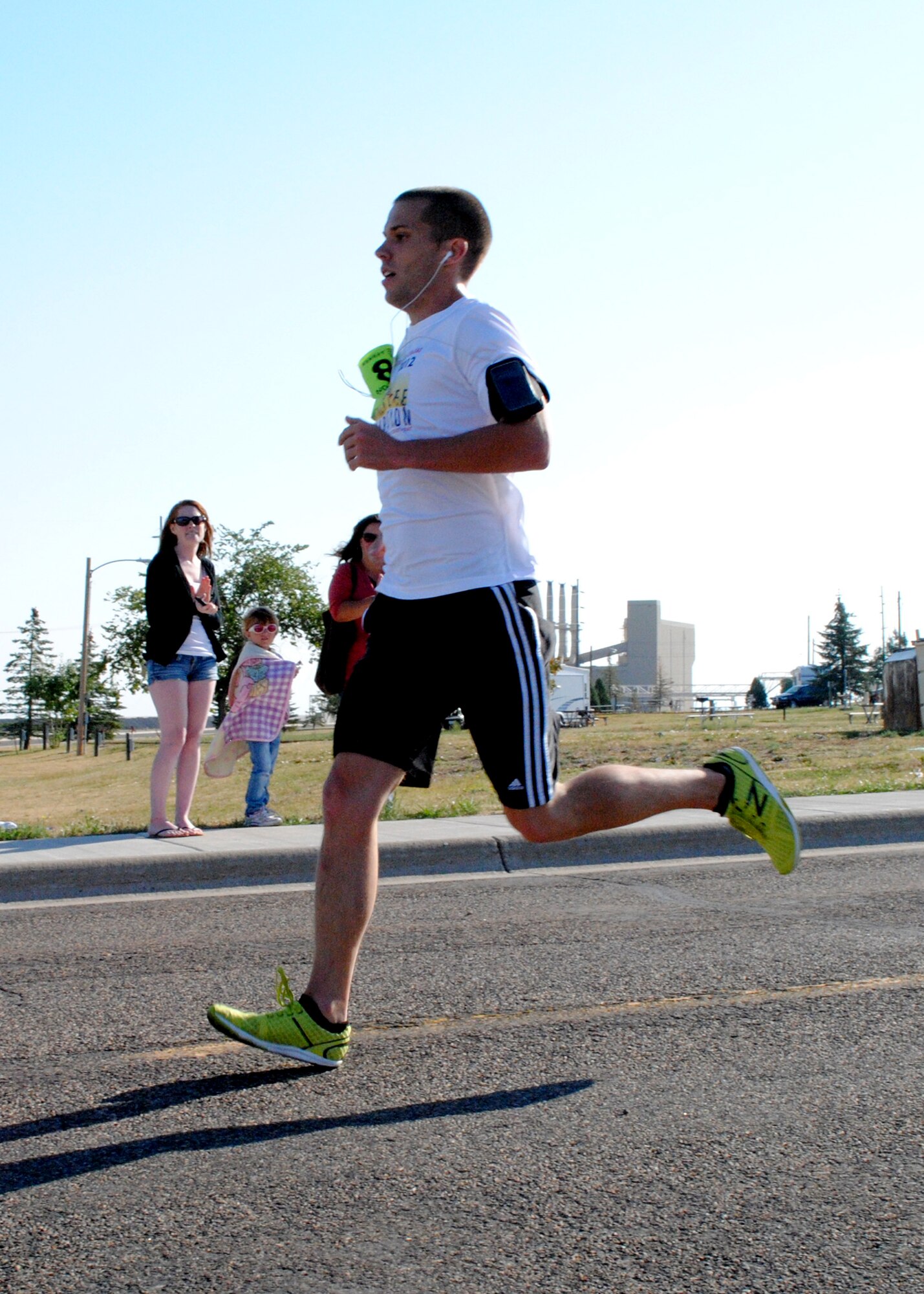 2nd Lt. Trent Cokley, 490th Missile Squadron deputy missile combat commander, sprints to the finish line during the Striker Life Half Marathon. Cokley finished the 13.1-mile race with a winning time of 1 hour, 30 minutes. (U.S. Air Force photo/Airman 1st Class Katrina Heikkinen)