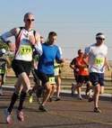 From left to right: Staff Sgt. Aaron Appelwick, 341st Missile Security Forces Squadron member, finished in fourth place; Chief Master Sgt. Duane Buchi, 341st Mission Support Group superintendant, finished in third place; and Staff Sgt. Kyle Adams, 341st Logistics Readiness Squadron vehicle operator, finished in fifth place in the Striker Life Half Marathon on Aug. 24. (U.S. Air Force photo/Airman 1st Class Katrina Heikkinen)