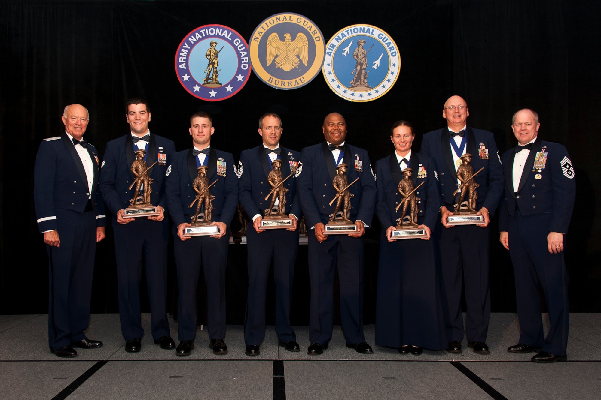 The 2012 Air National Guard Airmen of the Year pose for a photo during the 2012 Soldiers and Airmen of the Year banquet at the Sheraton Pentagon City, Arlington, Va 24, Aug 2012. Pictured are (left to right) Lt. Gen. Harry M. Wyatt III, the director of the ANG, Airman of the Year: Senior Airman Michael D. McCaffrey, 116th Air Refueling Wing, Washington ANG, Noncommissioned Officer of the Year: Tech. Sgt. Jacob S. Curtis, 126th Air Refueling Wing, Illinois ANG, Senior Noncommissioned Officer of the Year: Senior Master Sgt. Luke W. Thompson, 125th Special Tactics Squadron, Oregon ANG, First Sergeant of the Year: Master Sgt. Fred W. Hudgins Jr., 161st Air Refueling Wing, Arizona ANG, Honor Guard Member of the Year: Staff Sgt. Carrie M. Kline, 122nd Fighter Wing, Indiana ANG, Honor Guard Program Manager of the Year: Master Sgt. Jeffrey L. Lamarche, Eastern Air Defense Sector, New York ANG, and Chief Master Sgt. Christopher Muncy, the command chief master sergeant to the director of the ANG. (National Guard photo by Master Sgt. Marvin Preston/RELEASED)