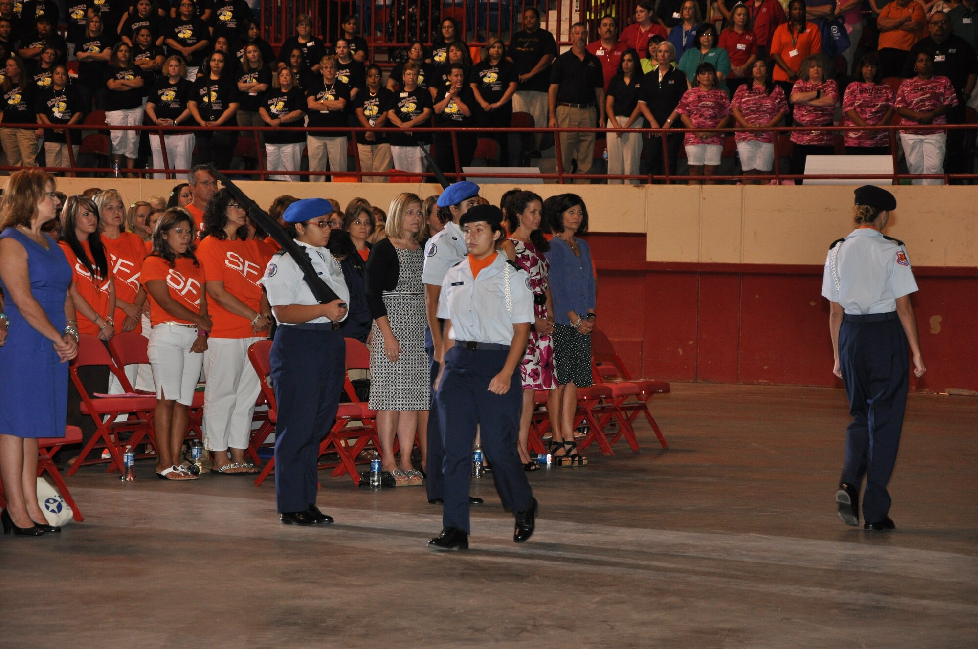 Members of the Air Force Junior Reserve Officer Training Corps from Central High School and Lake View High School Retire the Colors at the Foster Communications Coliseum Aug.23. The JROTC members were attending the “Back-to-School” convocation presented by the San Angelo Independent School District. (Air Force Photo/ Airman 1st Class Erica Flores)