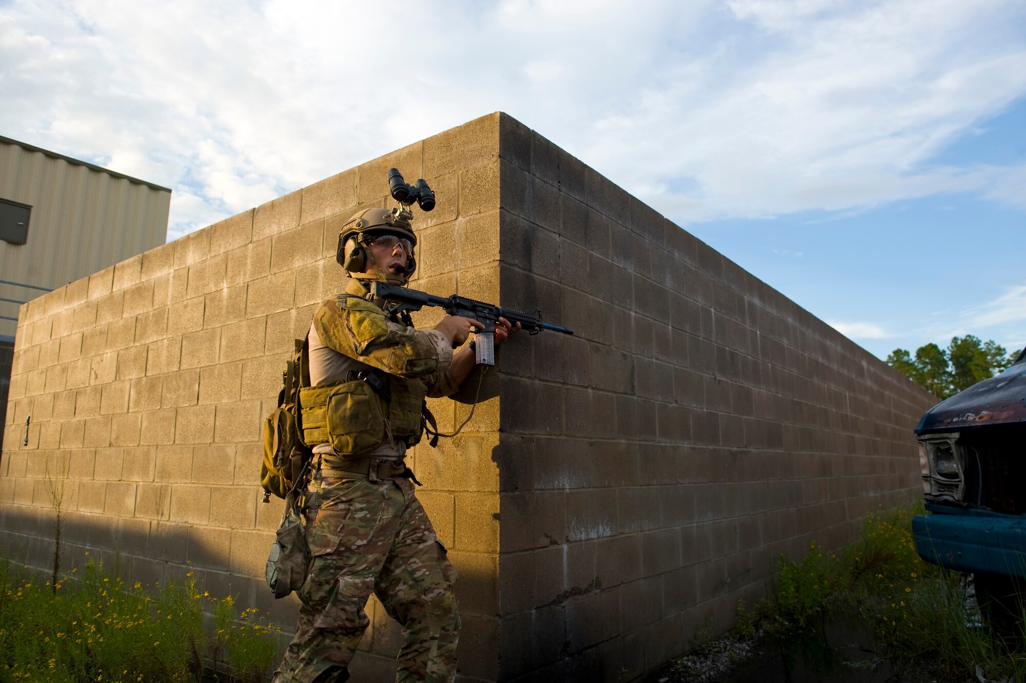 A U.S. Air Force pararescueman provides rear cover for an extraction team during an exercise on Eglin Range, Fla., Aug. 21, 2012. The pararescueman was participating in a scenario where his team had to respond to a simulated improvised explosive device explosion and transport the injured to safety.
(U.S. Air Force Photo/ Staff Sgt. John Bainter)
 